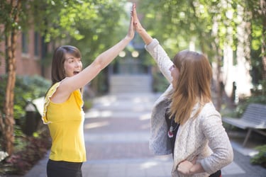 women high five