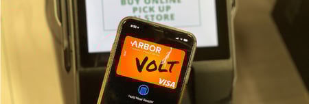 Member using tap to pay at store