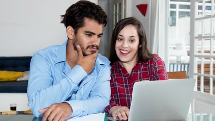 Couple looking at auto loan options