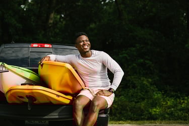 Young man enjoying his new truck during summer