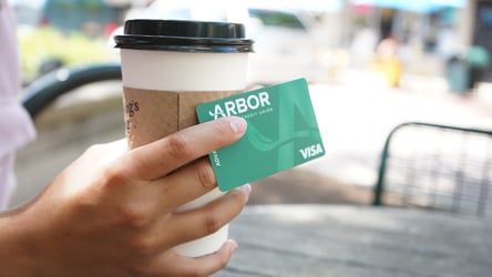 Women holding her new Balance transfer credit card 