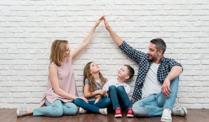 Family celebrating getting a new home in 2024