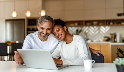 Couple looking over earnings from high-yield account