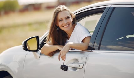 Women in newly bought leased car 