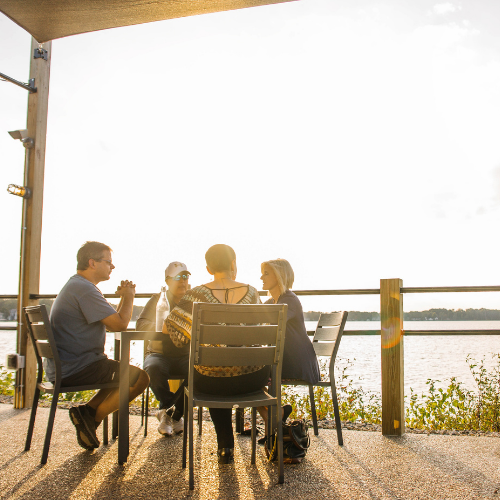 Group of friends at a lakefront.