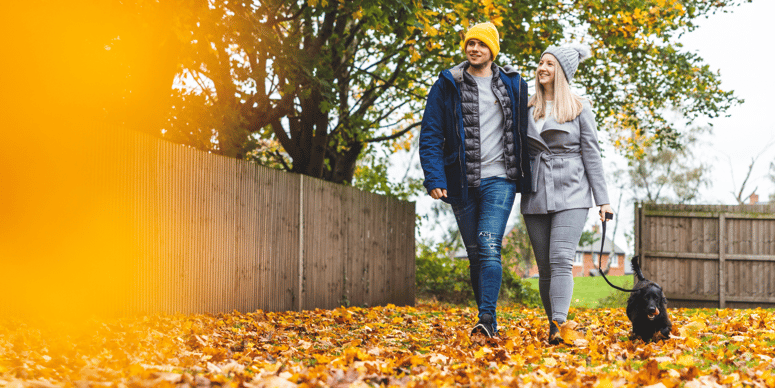 couple walking in fall scene