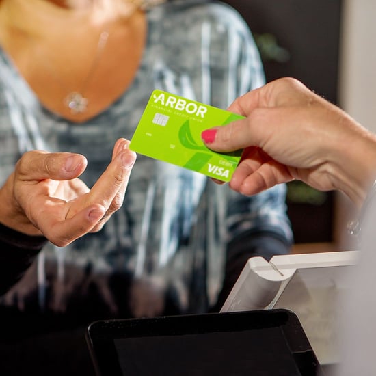 Customer using an Arbor debit card to make a payment.