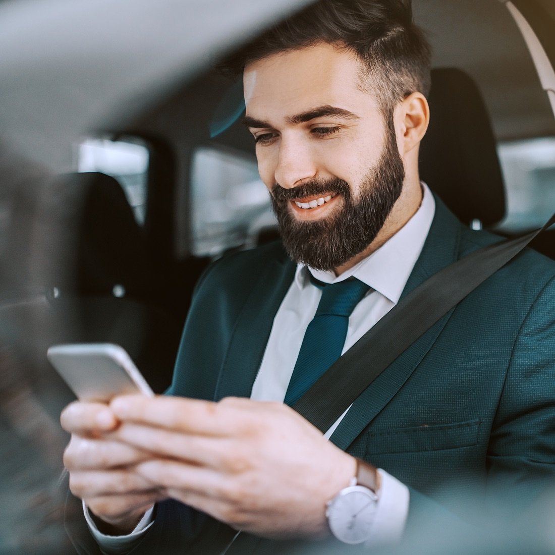 Arbor customer using their phone in a car.