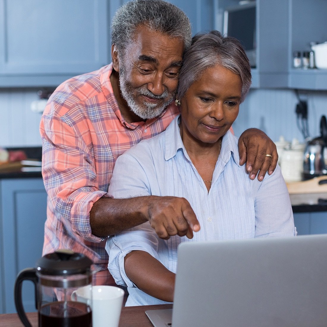 Retired couple using computer.