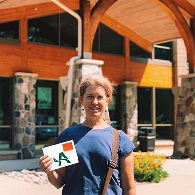 Jennifer outside of Arbor Financial Credit Union location.