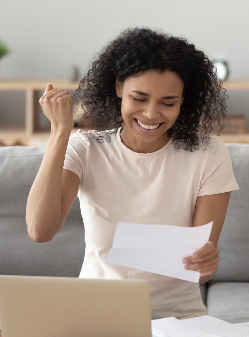 women looking at papers happy about new loan-01