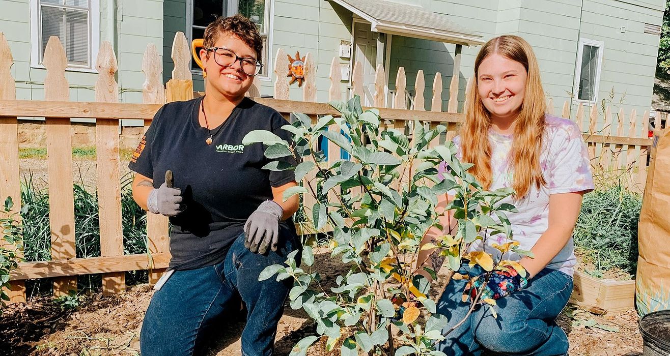 Arbor staff volunteering in a garden.