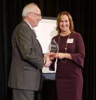 Julie Blitchok accepting Torch Award
