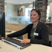 Dana Cubbage shown at the teller line at Arbor Financial's Gaines Township office.